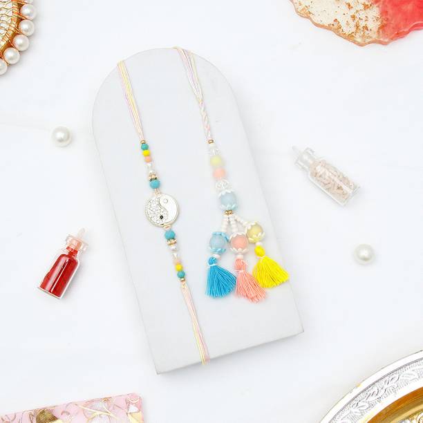 Thread Yin Yang Rakhi & Pastel Lumba Rakhi Set For Bhaiya Bhabhi With Greeting Card Assorted Rakhi, Greeting Card, Chawal Roli Pack Set by ARCHIES