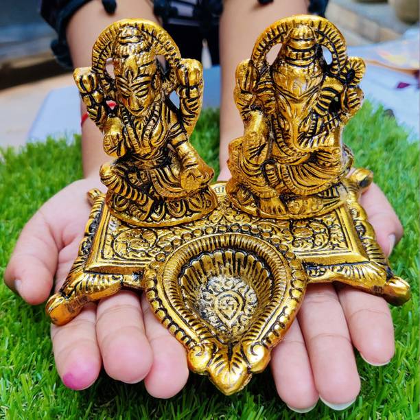 Wonder Care Ganesh Lakshmi Statue (Metal) Diya Statue Decorative Showpiece  -  14 cm