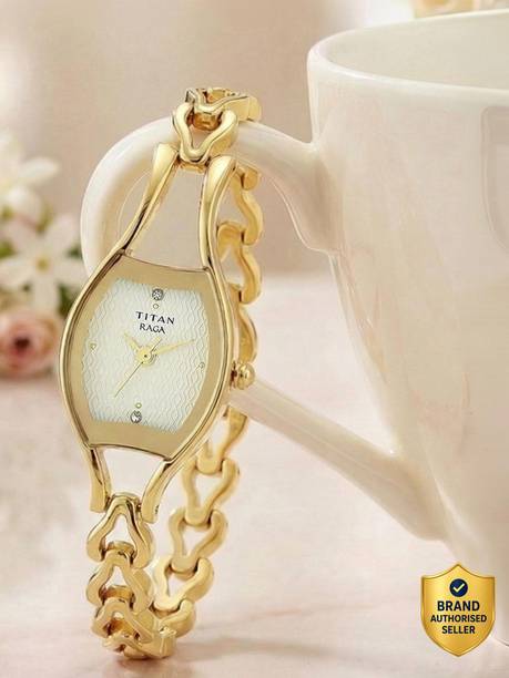 Titan Raga Champagne Dial Gold Metal Strap Analog Watch - For Women NT2331YM02,NU2331YM02