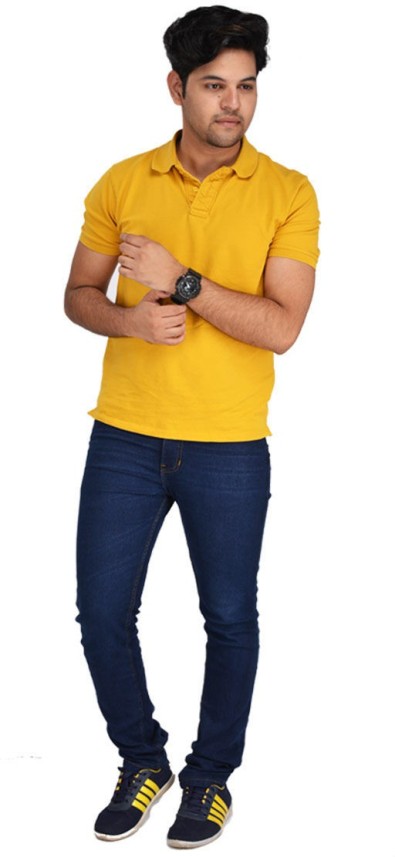 yellow shirt dark blue jeans