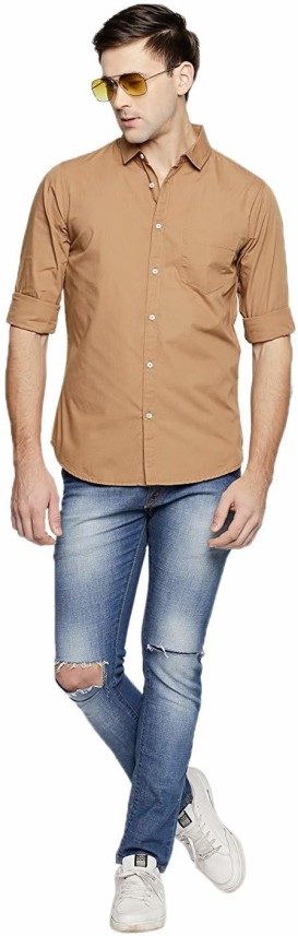 brown shirt with light blue jeans