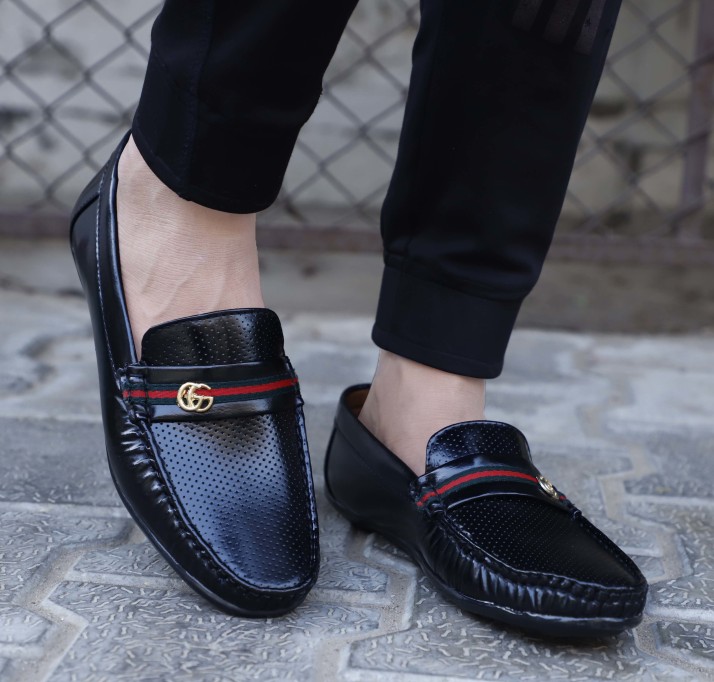 men branded loafers