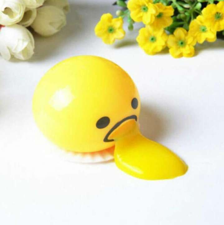 Squishy puking egg yolk stress ball with yellow goop store