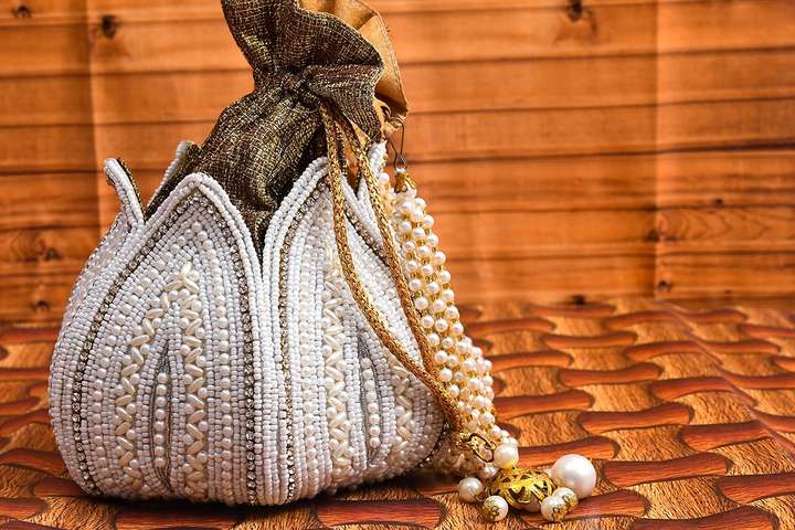 Nakh Clothing Women s Ethnic Potli Bags for Wedding Bridal Purse Clutch Batwa Pouch Potli White and Golden Price in India Flipkart
