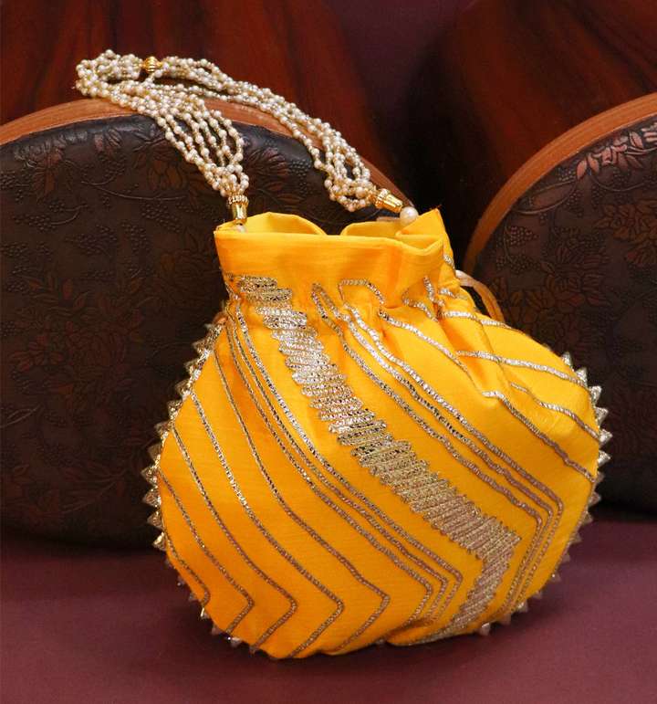 sakshi collection Women Potali Yellow Handbag Matka Designer Handbags for Women Potli Yellow Price in India Flipkart