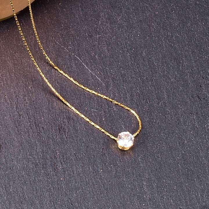 Single diamond gold necklace hotsell