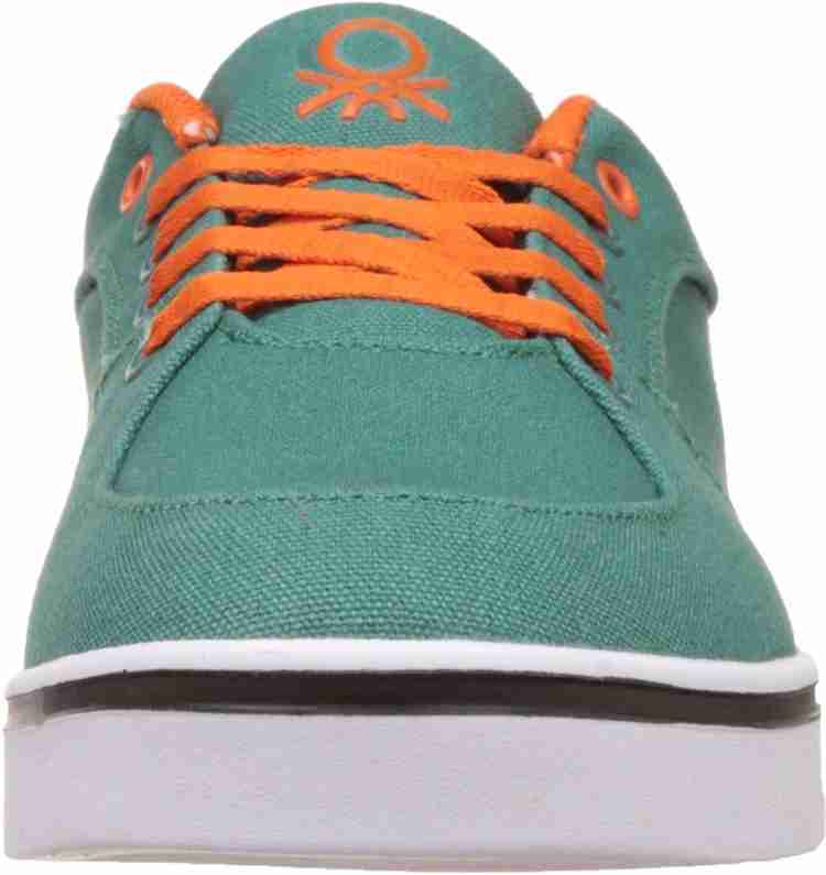 Ucb sales orange sneakers