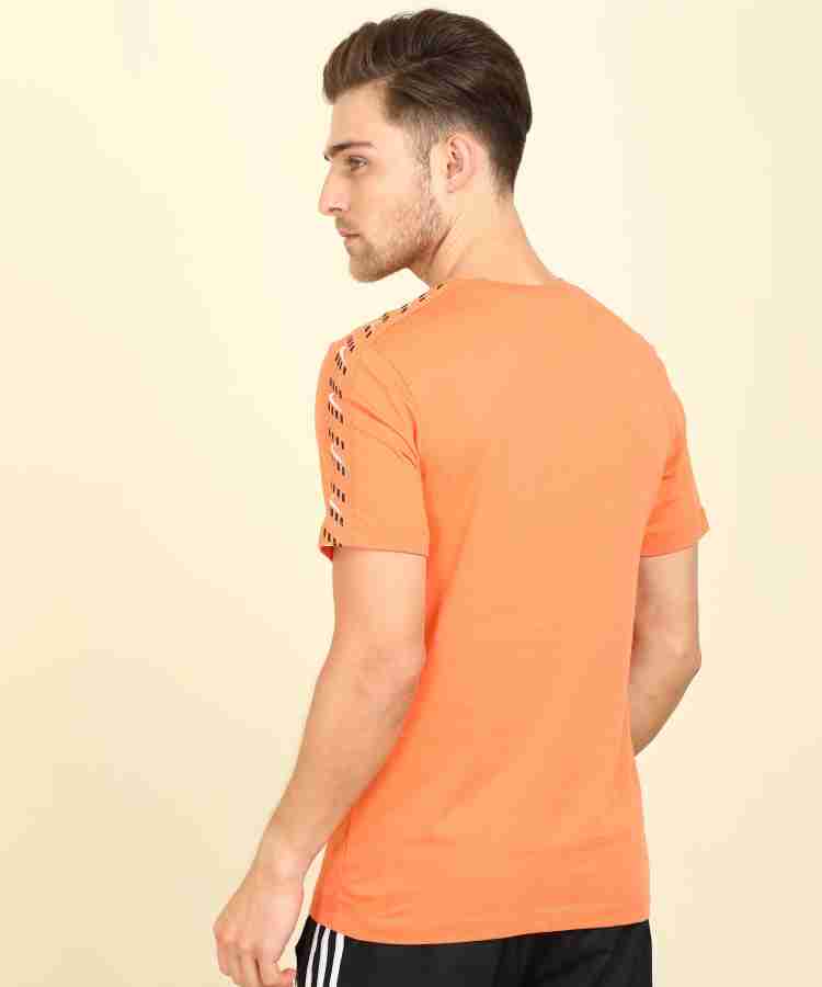 Nike total best sale orange shirt