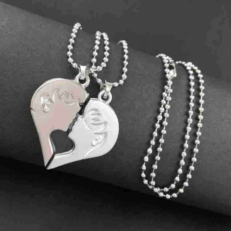 Boy kissing girl necklace shop