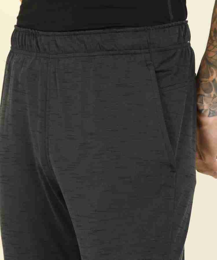 NIKE Yoga Dri-FIT Self Design Men Black Track Pants - Buy NIKE