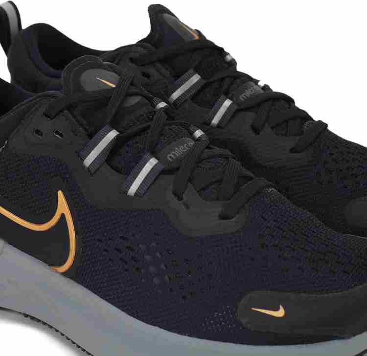 Nike running legend react sneakers in black and gold best sale