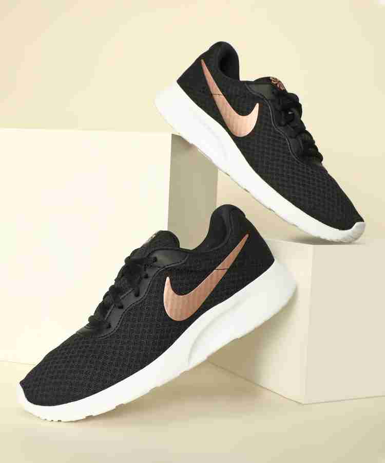 Black and best sale gold nike tanjun
