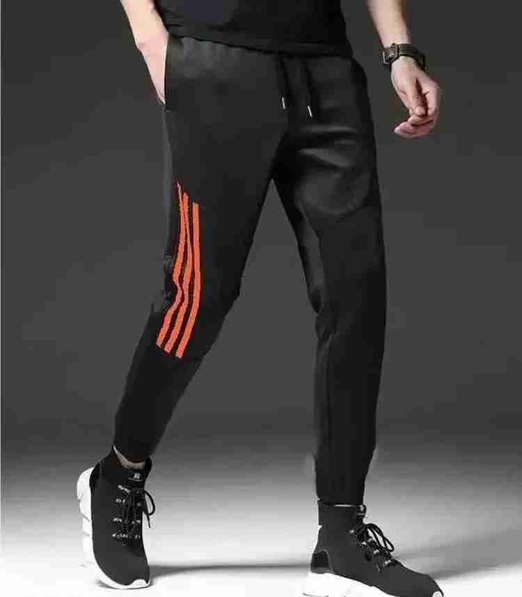 Orange and black track pants discount