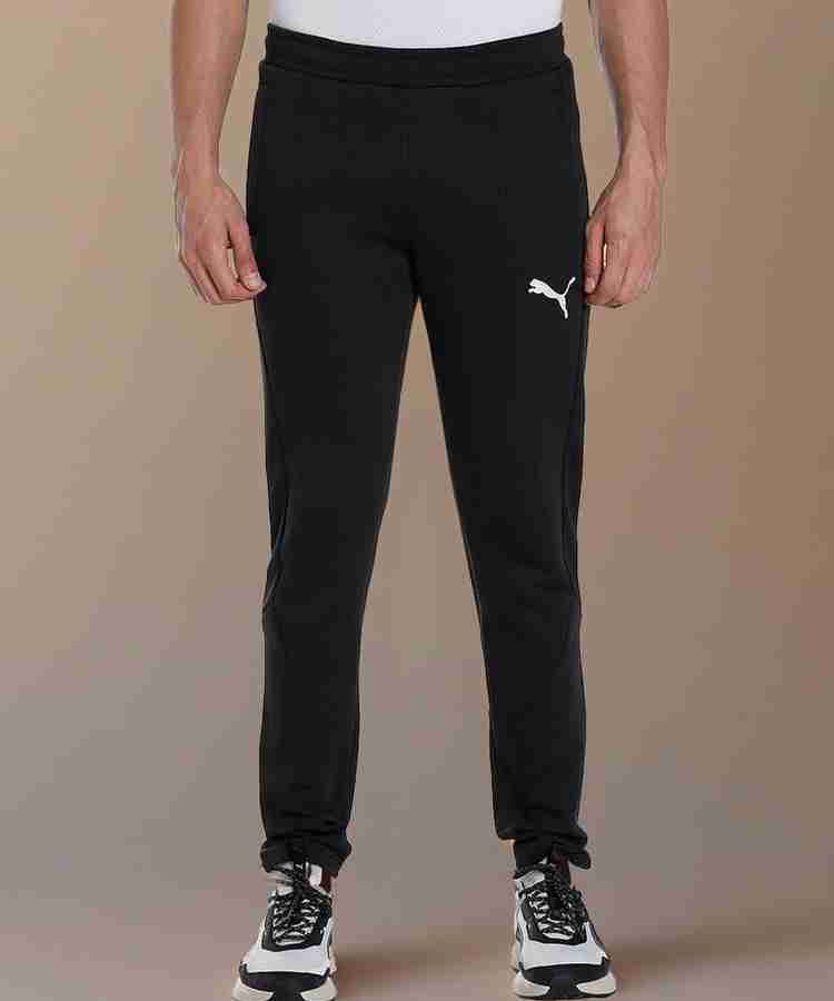 PUMA EVOSTRIPE Pants Solid Men Black Track Pants Buy PUMA