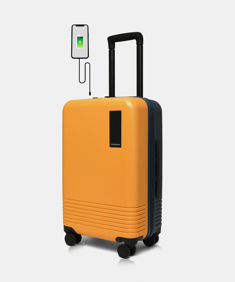 Mokobara Mokobara Cabin Suitcase (57.8 cm) 8 Wheels - The Cabin Luggage Polycarbonate 55 cms Hardsided Suitcase Trolley - Yellow, Orange