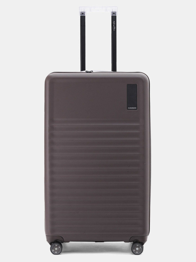 Mokobara Mokobara Check-in Suitcase (76.5 cm) 8 Wheels - The Aisle Trunk - Check-in Large - Brown