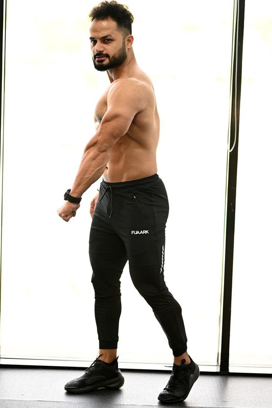 FuaarK Men Black, White Printed Track Pants - Image 5