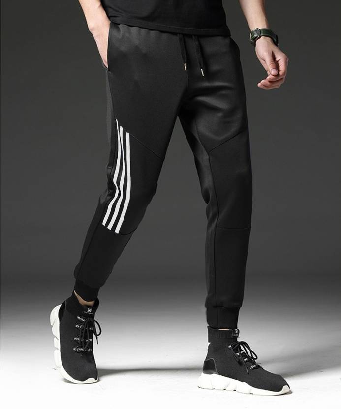Foxter Solid Men Black, White Track Pants Buy Foxter Solid Men Black, White Track Pants Online