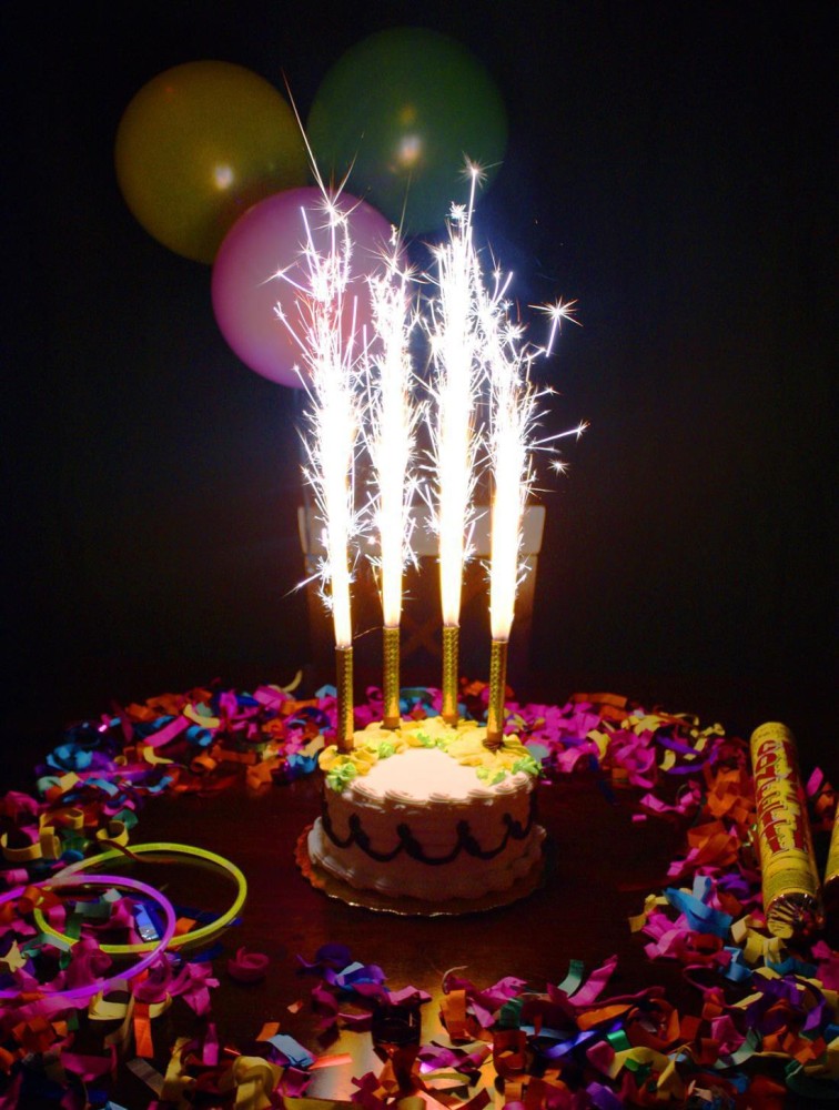 Premium Photo | Festive birthday cake with beautiful sparklers. cake with  raspberries, wild berries and ikokos.