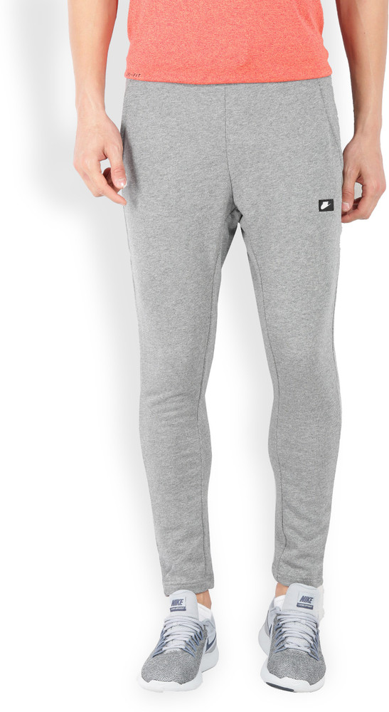 NIKE Solid Men Grey Track Pants Buy CARBON HEATHER BLACK NIKE