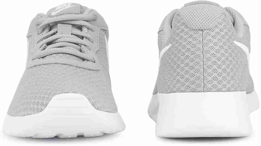 Nike women's tanjun on sale running sneaker wolf grey/white