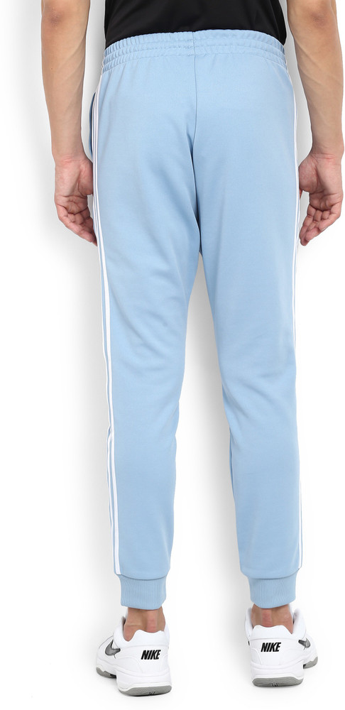 Light blue adidas track pants top