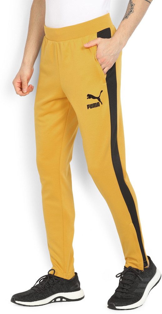PUMA Solid Men Yellow Track Pants Buy Mineral Yellow black PUMA