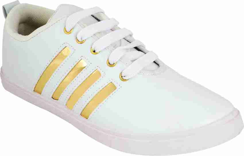 White shoes with hot sale gold stripes