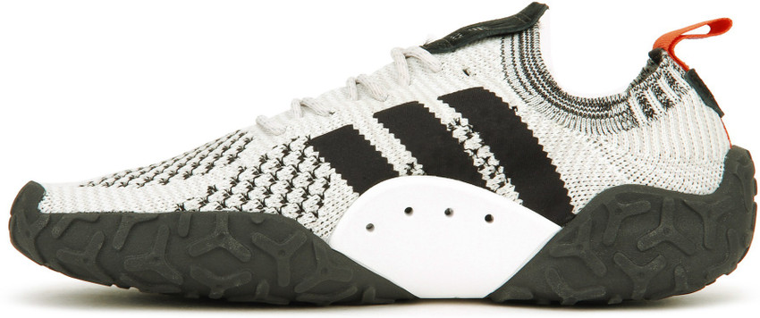 Adidas originals f 22 primeknit shop sneakers in off white