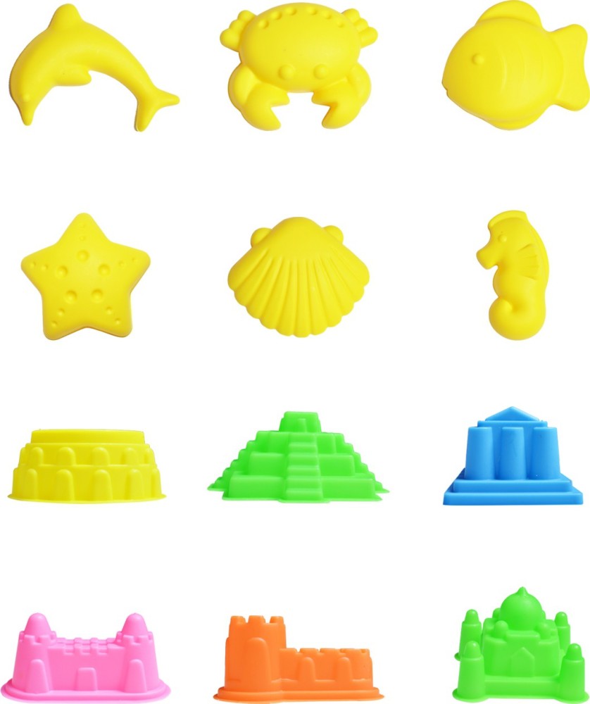 Top View Yellow Kinetic Sand with Molds. Magic Sand for Children