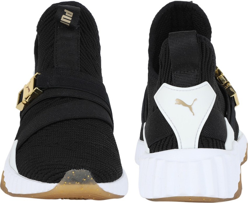 Puma defy varsity mid sale black & gold shoes