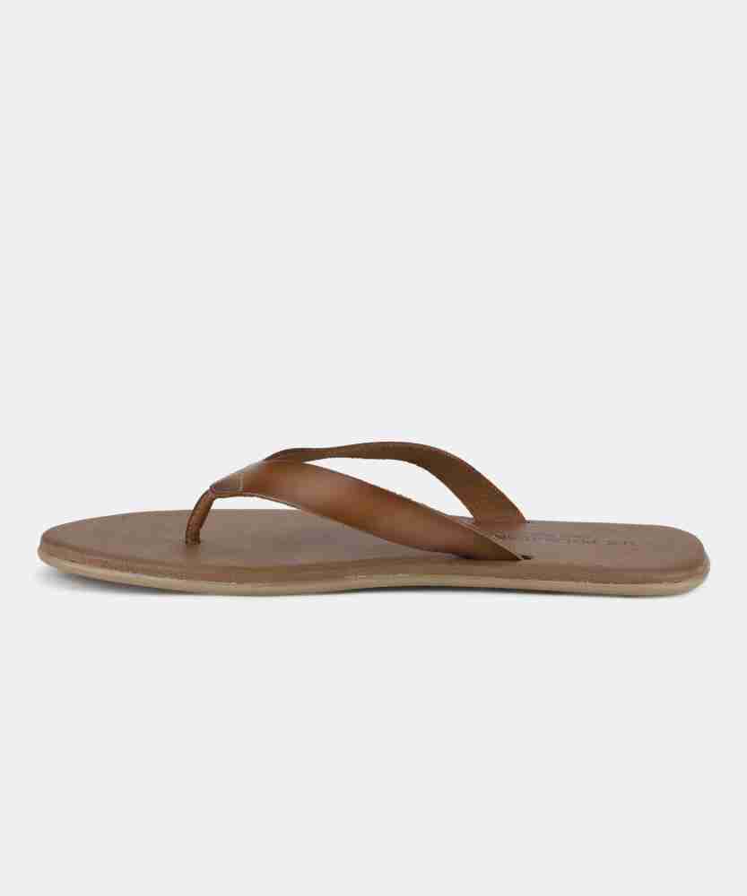 Us polo assn shop norwalk tan slippers