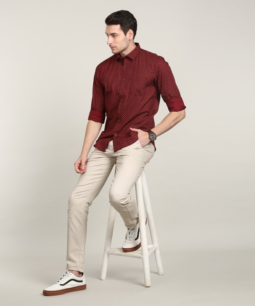 Buy Men's Solid Regular Fit Belted Chinos with Pockets Online | Centrepoint  KSA