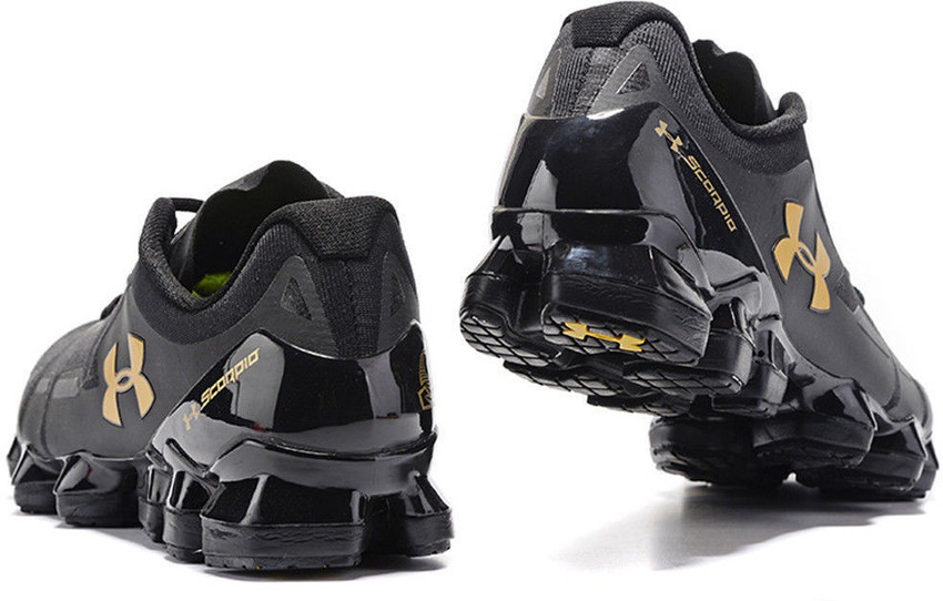 Under armour scorpio black gold top