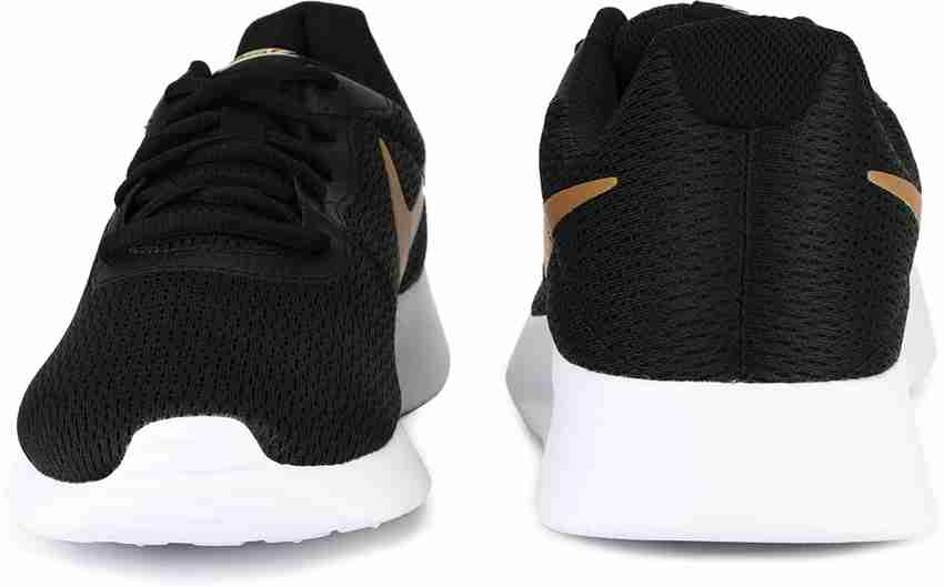 Nike tanjun black gold original online