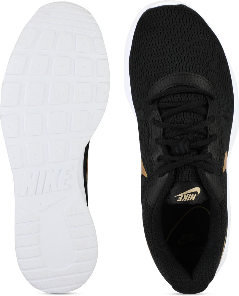 nike tanjun black white gold