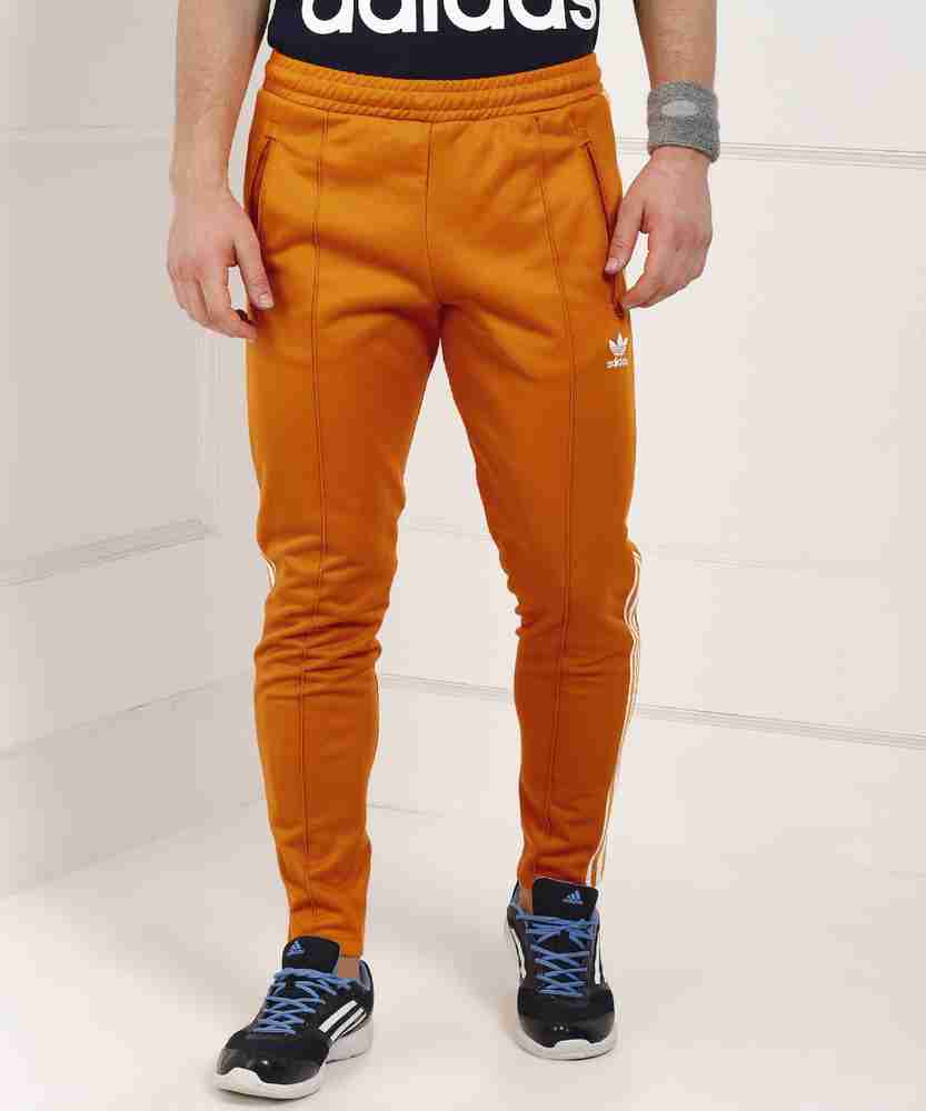 Adidas beckenbauer clearance orange pants