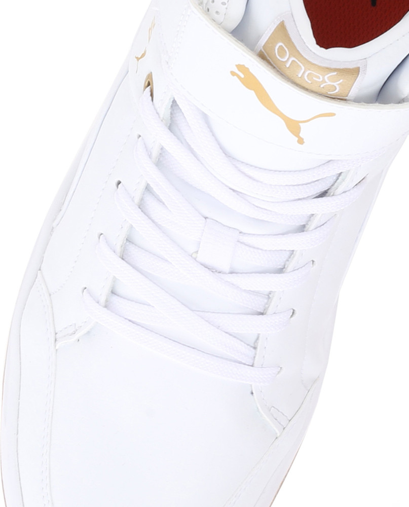 white and gold high top pumas