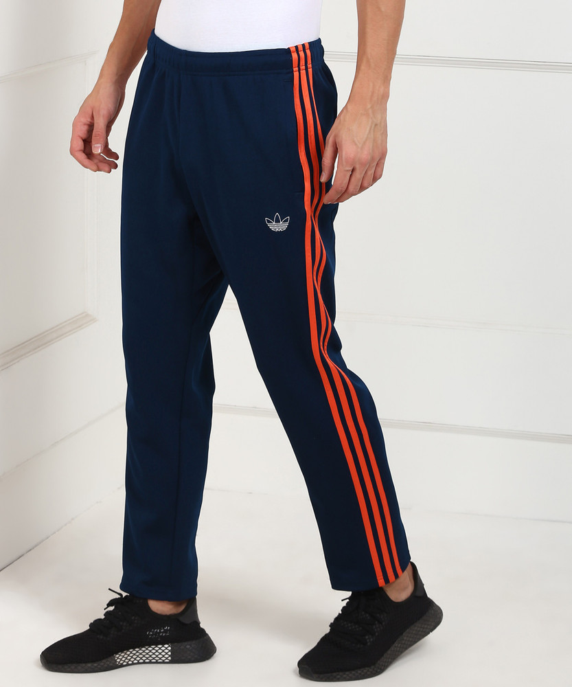 Adidas track pants cheap blue with red stripes