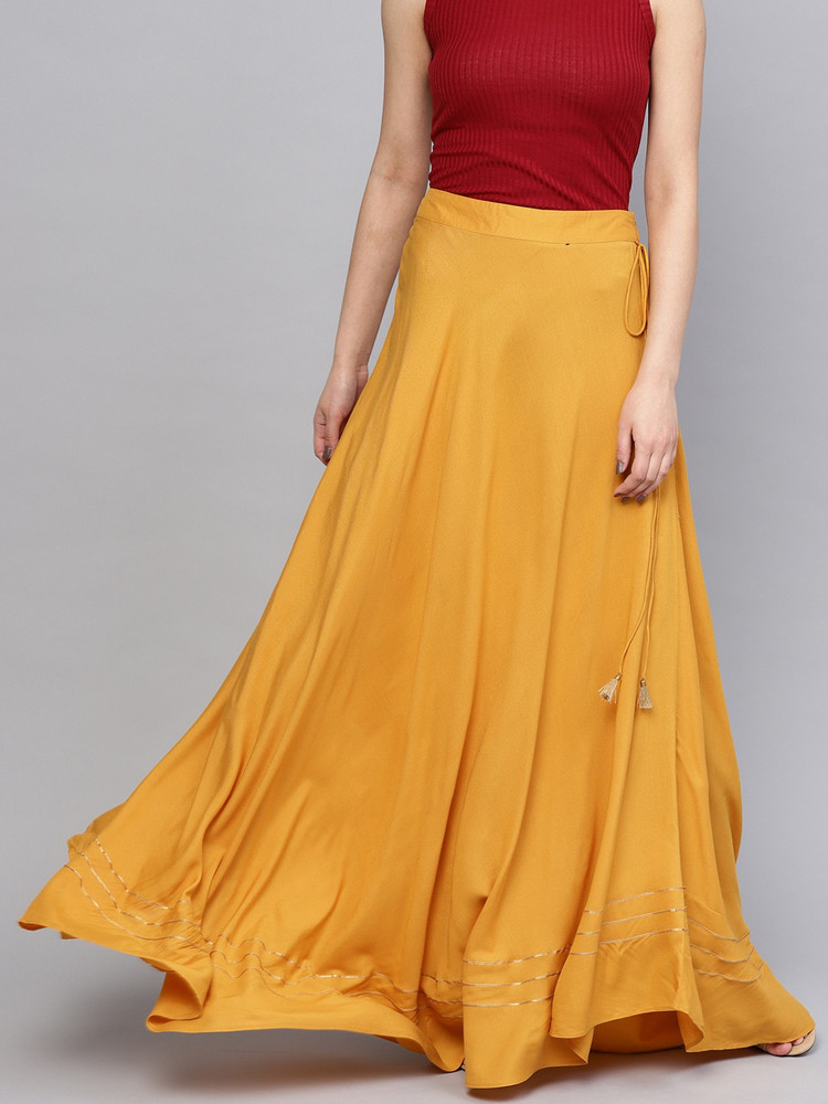 red top yellow skirt