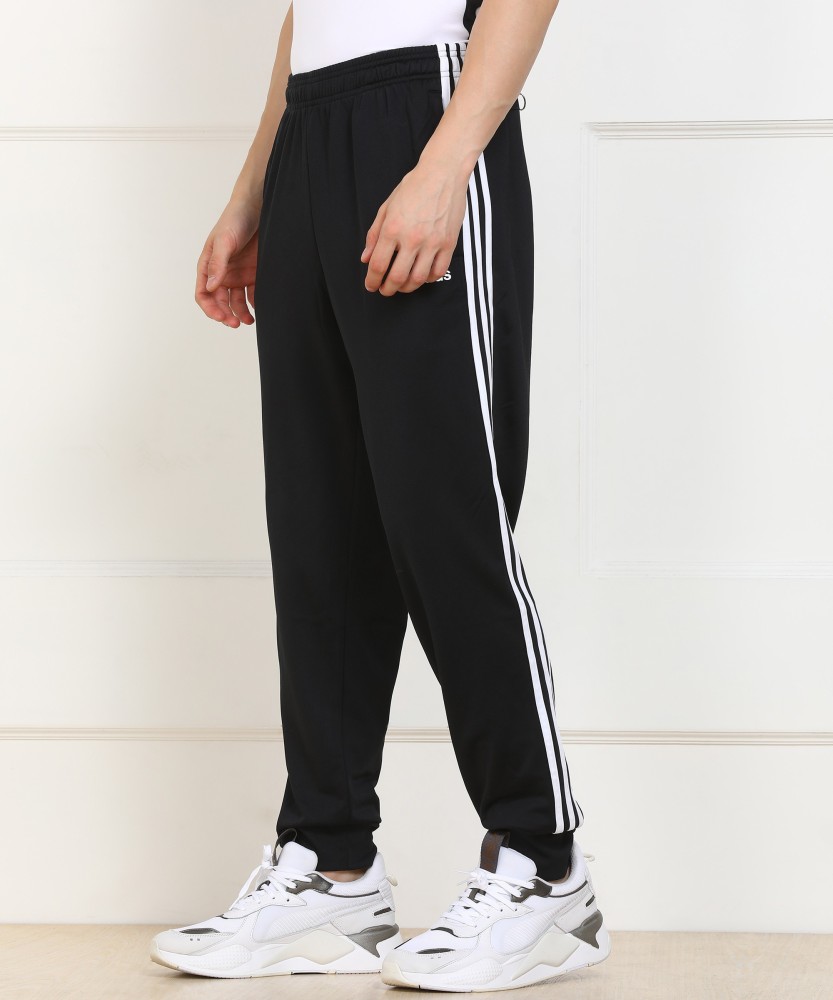 Black track pants with white stripe online