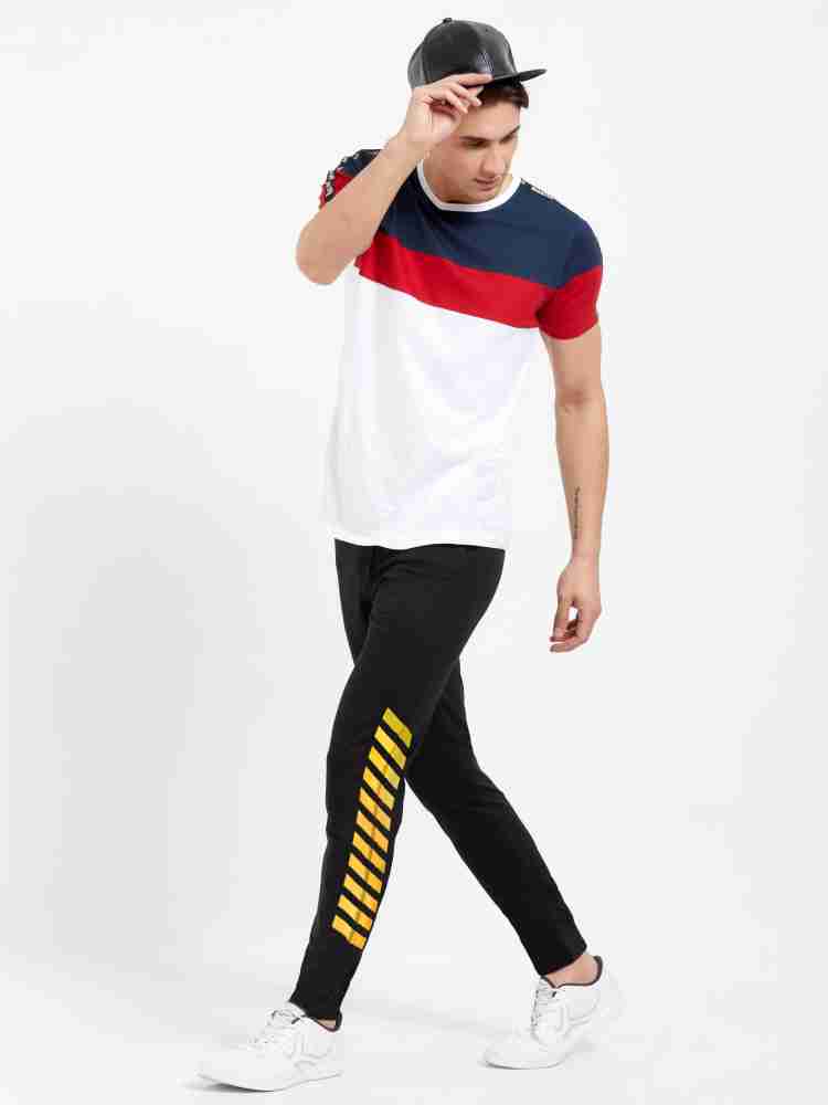 Yellow track pants outlet with black stripe