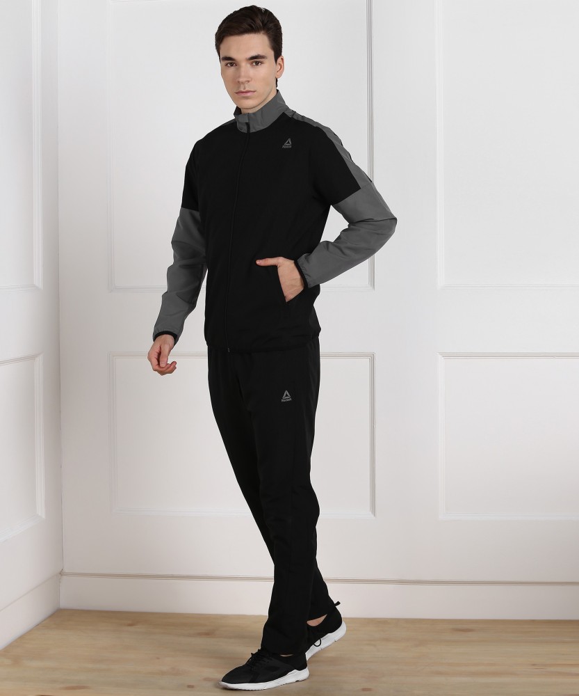 reebok woven tracksuit mens