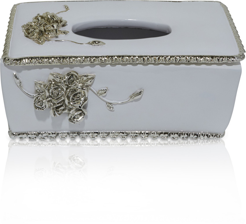 Ceramic tissue holder outlet
