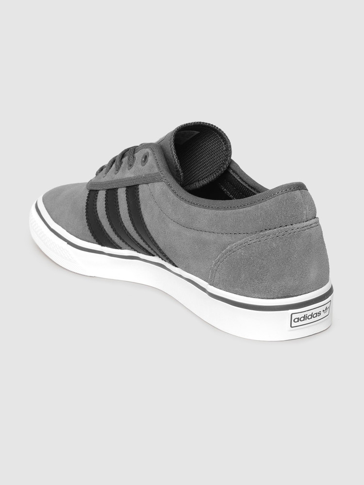 Grey adidas top skate shoes