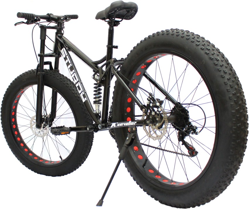 STURDY DUAL SUSPENSION FAT MOUNTAIN BIKE WITH 26X4 INCH WHEELS AND