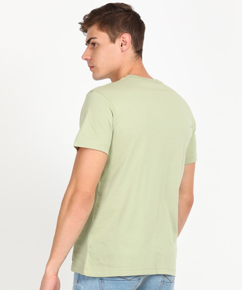 Calvin Klein Jeans Solid Men Round Neck Green T-Shirt - Buy Calvin Klein  Jeans Solid Men Round Neck Green T-Shirt Online at Best Prices in India