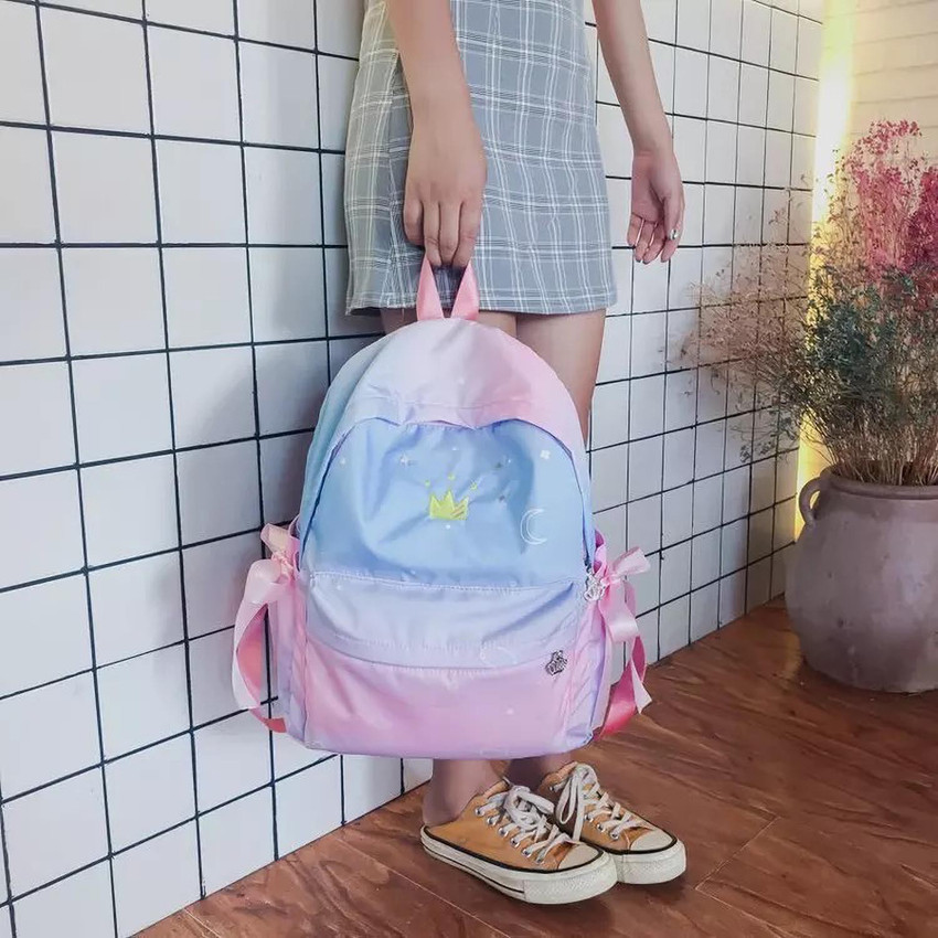Crown detail online bow tie backpack