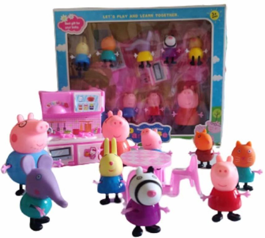 A plastic Peppa Pig toy play house standing on a table Stock Photo