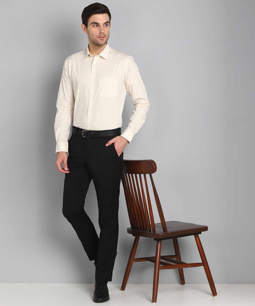 cream colour shirt and black pant